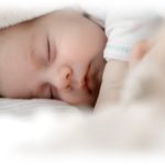 sleeping baby wrapped in blanket